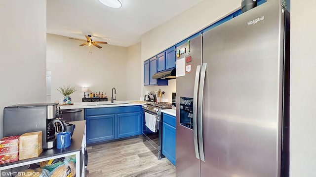 267 Juniper Cir, Streamwood, IL 60107 - kitchen featuring stainless steel appliances, a sink, blue cabinetry, and under cabinet range hood