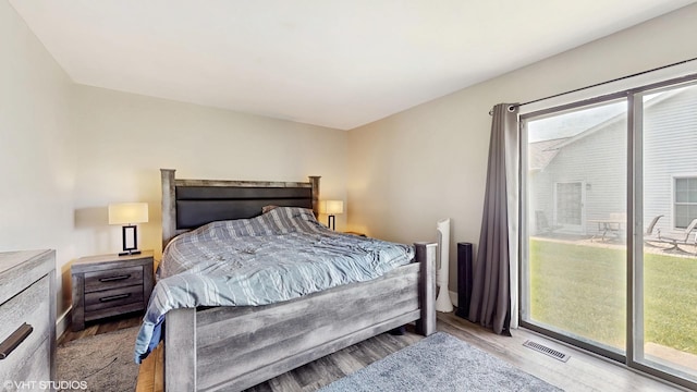 267 Juniper Cir, Streamwood, IL 60107 - bedroom with wood finished floors and access to exterior