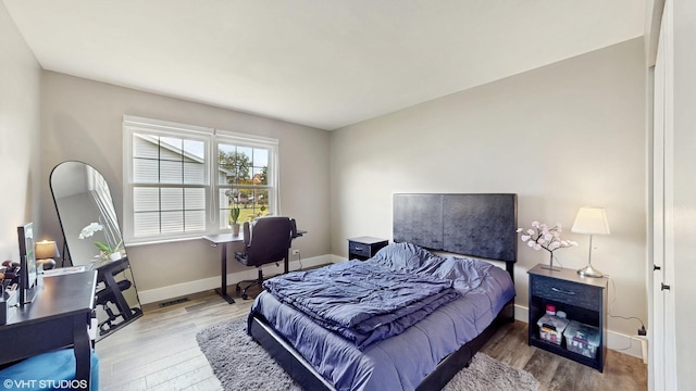 267 Juniper Cir, Streamwood, IL 60107 - bedroom with wood finished floors, a desk, and baseboards