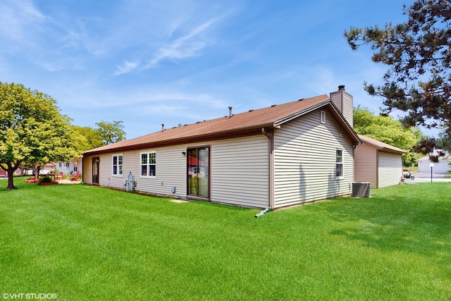 267 Juniper Cir, Streamwood, IL 60107 - back of property with a chimney, central AC unit, and a yard