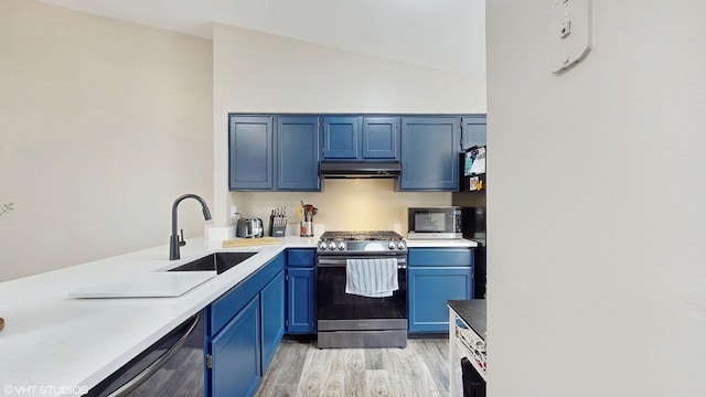 267 Juniper Cir, Streamwood, IL 60107 - kitchen featuring stainless steel appliances, a sink, under cabinet range hood, light wood-style flooring, and blue cabinets