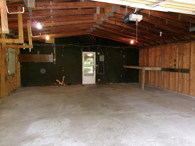 143 W Scott St, Seneca, IL 61360 - garage featuring a garage door opener and electric panel
