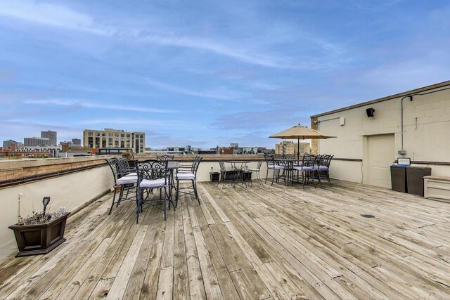 4706 N Winthrop Ave Unit 1A, Chicago, IL 60640 - deck featuring outdoor dining space and a city view