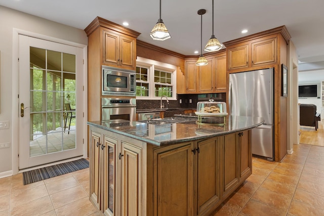 218 Delnor Ave, Saint Charles, IL 60174 - kitchen with appliances with stainless steel finishes, dark stone counters, backsplash, brown cabinets, and pendant lighting