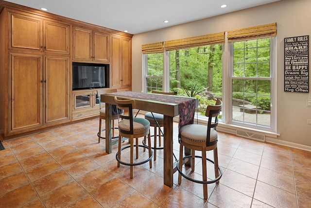 218 Delnor Ave, Saint Charles, IL 60174 - dining room with baseboards, recessed lighting, and light tile patterned floors
