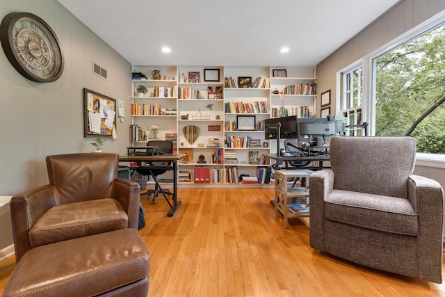 218 Delnor Ave, Saint Charles, IL 60174 - sitting room featuring a desk, light wood finished floors, and wooden walls