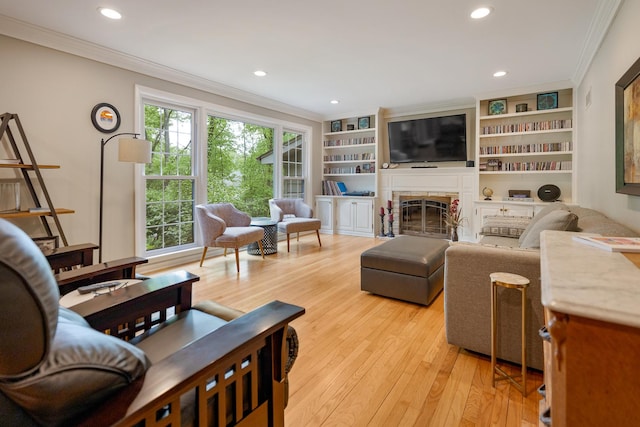 218 Delnor Ave, Saint Charles, IL 60174 - living room with crown molding, light wood-style flooring, recessed lighting, and a fireplace
