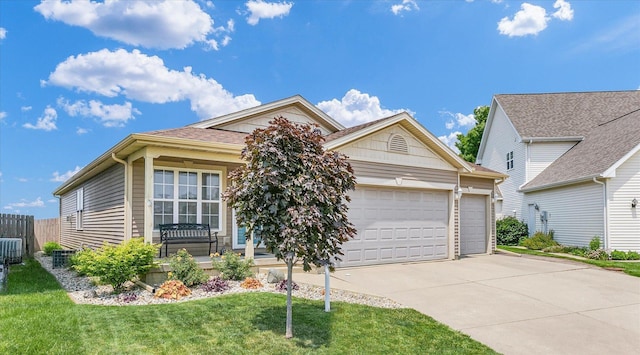 1321 W Ridge Ln, Champaign, IL 61822 - view of front of home featuring concrete driveway, an attached garage, and covered porch