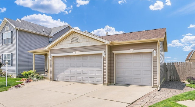 1321 W Ridge Ln, Champaign, IL 61822 - view of front of property with driveway, an attached garage, and a shingled roof
