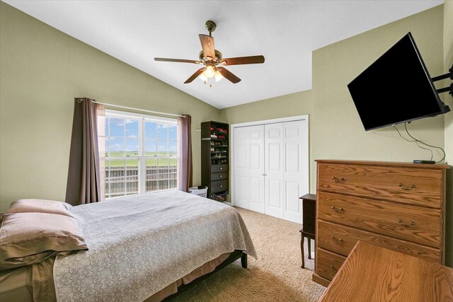 1321 W Ridge Ln, Champaign, IL 61822 - carpeted bedroom with vaulted ceiling, a closet, and ceiling fan