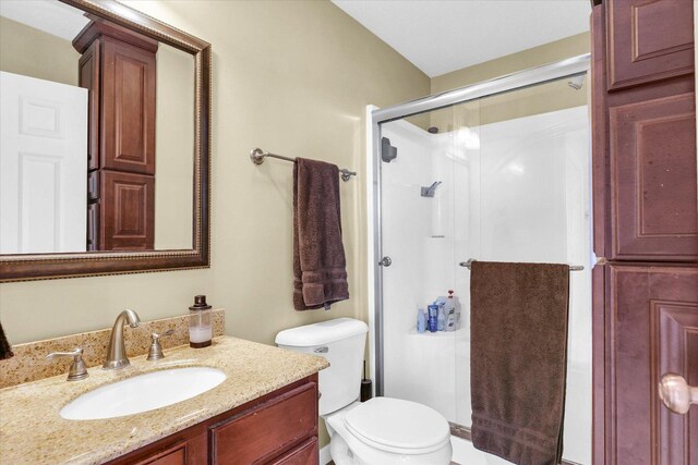 1321 W Ridge Ln, Champaign, IL 61822 - full bathroom featuring a stall shower, toilet, and vanity