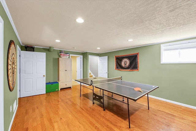 1321 W Ridge Ln, Champaign, IL 61822 - recreation room featuring a textured ceiling, recessed lighting, light wood finished floors, baseboards, and crown molding