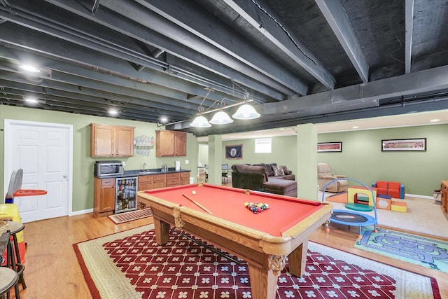 1321 W Ridge Ln, Champaign, IL 61822 - playroom with beverage cooler, wet bar, billiards, light wood-style flooring, and baseboards