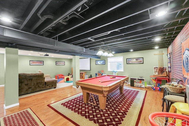 1321 W Ridge Ln, Champaign, IL 61822 - playroom with wood finished floors, billiards table, and baseboards