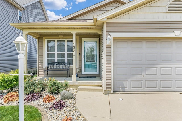 1321 W Ridge Ln, Champaign, IL 61822 - doorway to property with covered porch and an attached garage