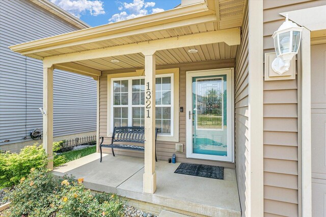 1321 W Ridge Ln, Champaign, IL 61822 - view of exterior entry with a porch