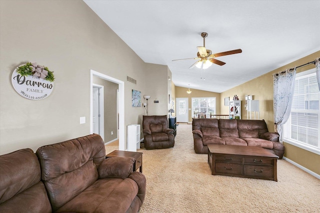 1321 W Ridge Ln, Champaign, IL 61822 - living room with lofted ceiling, light colored carpet, ceiling fan, and baseboards