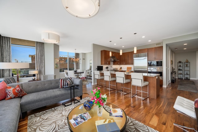 540 W Webster Ave Unit 611, Chicago, IL 60614 - living area with dark wood-style floors, recessed lighting, and a chandelier