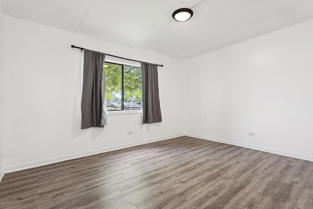 7131 166th St Unit 101, Tinley Park, IL 60477 - empty room featuring wood finished floors and baseboards