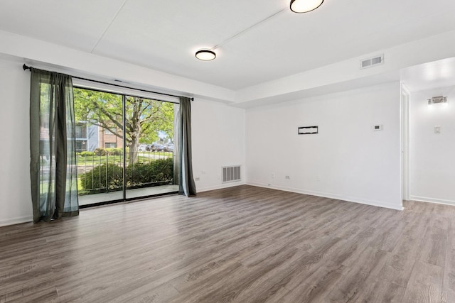 7131 166th St Unit 101, Tinley Park, IL 60477 - unfurnished room featuring wood finished floors and baseboards