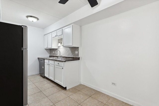 7131 166th St Unit 101, Tinley Park, IL 60477 - kitchen featuring stainless steel appliances, a sink, decorative backsplash, and baseboards