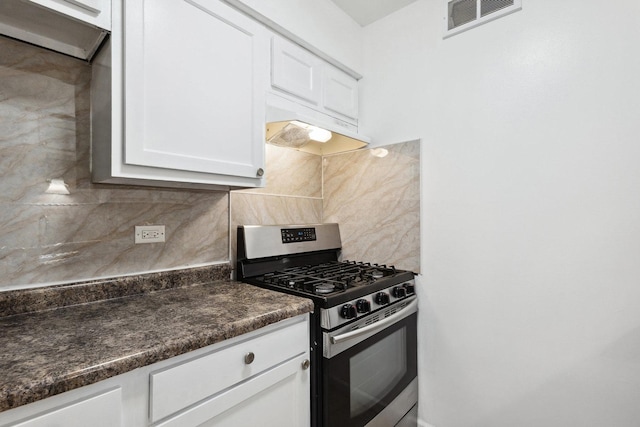 7131 166th St Unit 101, Tinley Park, IL 60477 - kitchen with stainless steel gas stove, dark countertops, decorative backsplash, and white cabinets