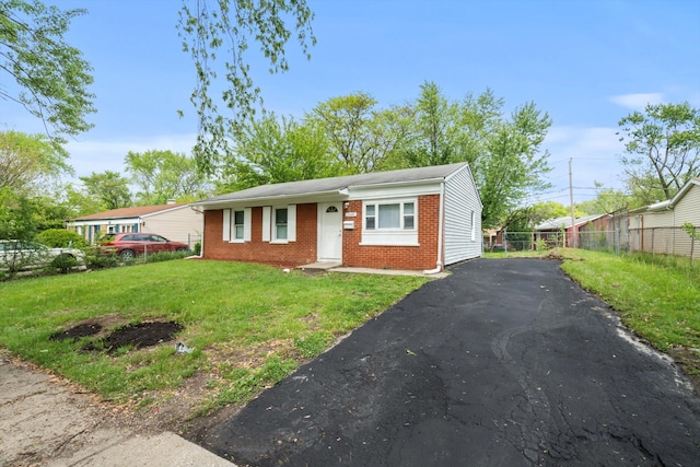 21643 Merrill Ave, Sauk Village, IL 60411 - view of front of house with brick siding and asphalt driveway