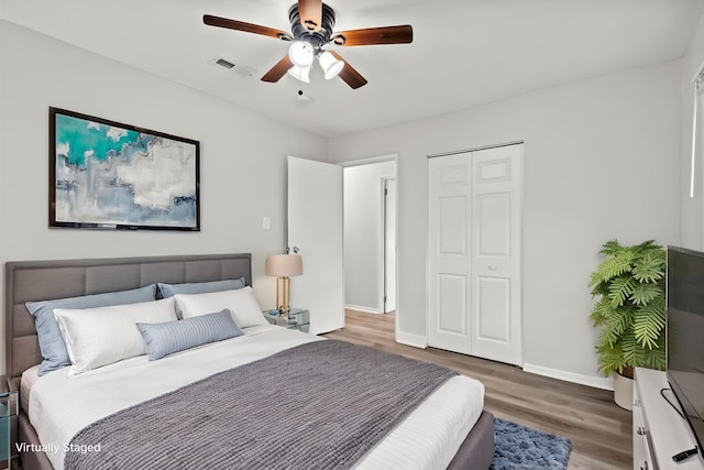 21643 Merrill Ave, Sauk Village, IL 60411 - bedroom featuring wood finished floors, baseboards, a closet, and ceiling fan