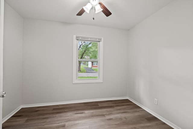 21643 Merrill Ave, Sauk Village, IL 60411 - spare room with dark wood-type flooring, ceiling fan, and baseboards