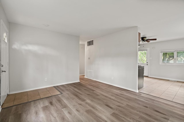 21643 Merrill Ave, Sauk Village, IL 60411 - unfurnished room with light wood-style flooring, a ceiling fan, and baseboards