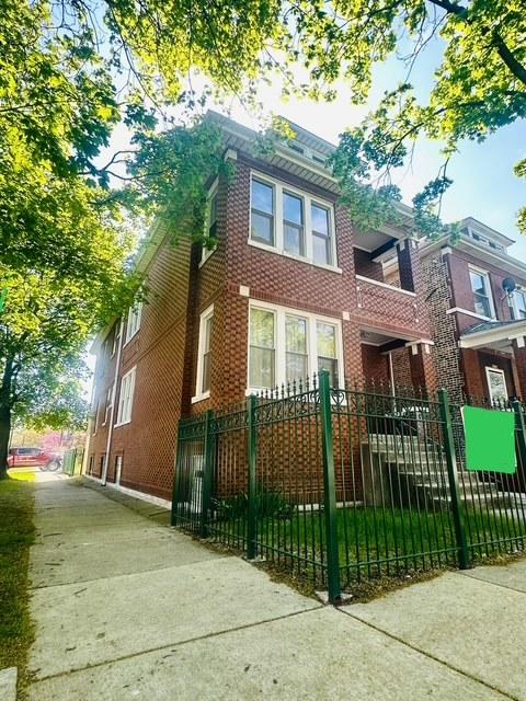 4001 S Albany Ave, Chicago, IL 60632 - view of front facade with brick siding and a fenced front yard
