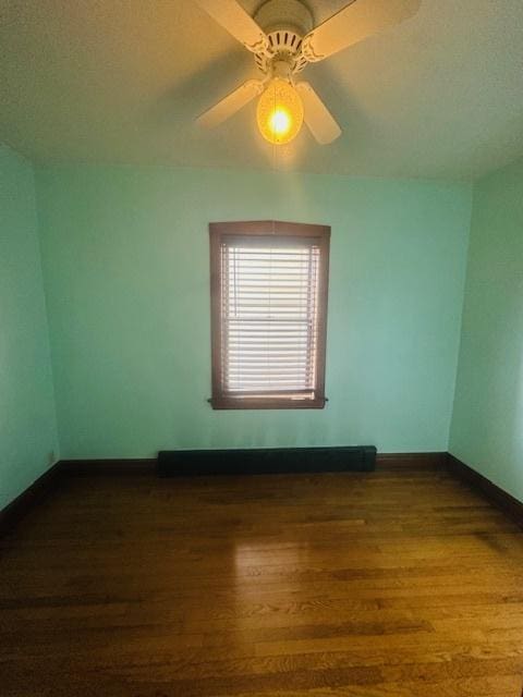 4001 S Albany Ave, Chicago, IL 60632 - spare room featuring dark wood-style floors, baseboards, and a ceiling fan
