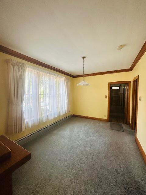 4001 S Albany Ave, Chicago, IL 60632 - carpeted spare room with baseboards, crown molding, and a smoke detector
