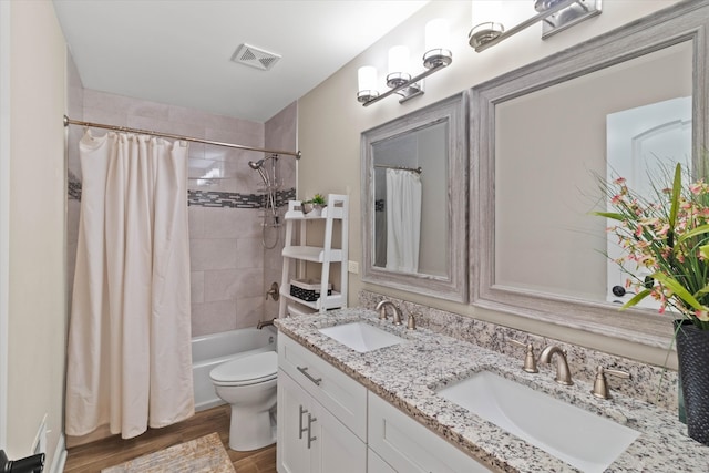 2952 W 100th Pl, Evergreen Park, IL 60805 - bathroom featuring toilet, shower / tub combo with curtain, double vanity, and wood finished floors