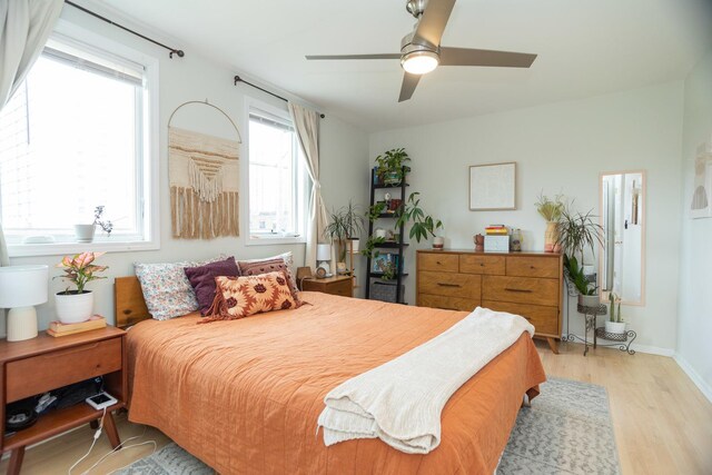 919 W Leland Ave Unit F, Chicago, IL 60640 - bedroom featuring light wood-type flooring, ceiling fan, and baseboards