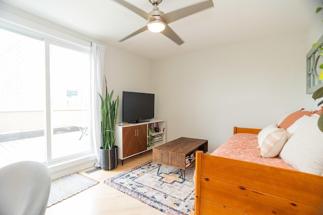 919 W Leland Ave Unit F, Chicago, IL 60640 - bedroom with multiple windows, light wood-type flooring, and ceiling fan