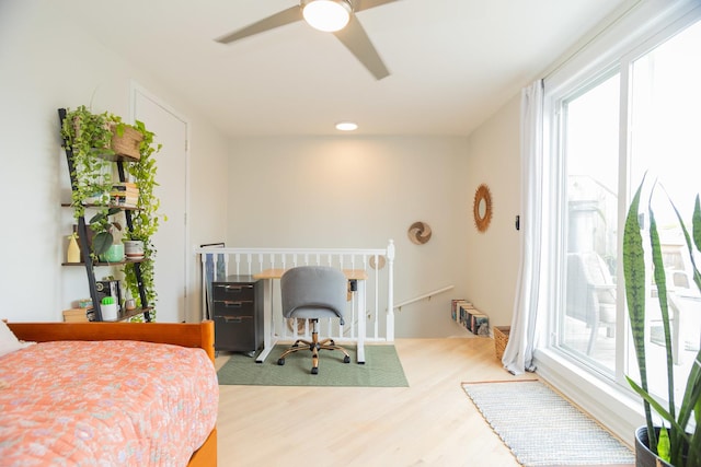 919 W Leland Ave Unit F, Chicago, IL 60640 - bedroom with multiple windows, wood finished floors, a ceiling fan, and access to exterior