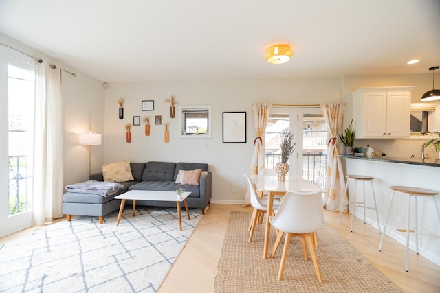 919 W Leland Ave Unit F, Chicago, IL 60640 - dining room with plenty of natural light, light wood-type flooring, recessed lighting, and baseboards