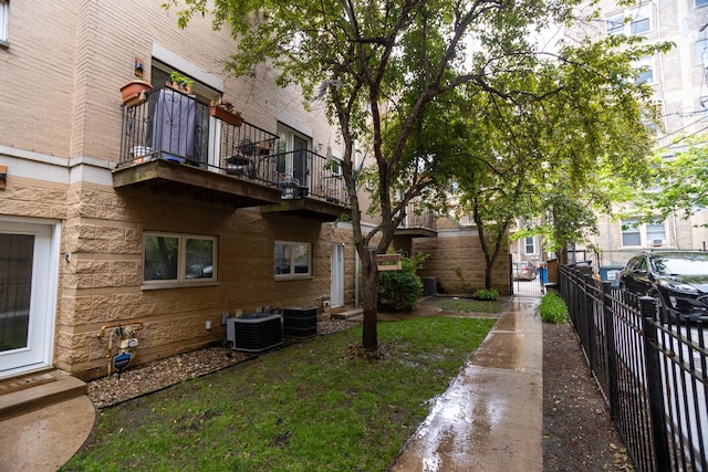 919 W Leland Ave Unit F, Chicago, IL 60640 - view of yard featuring central AC unit and a balcony