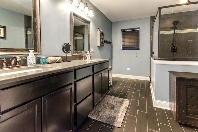 1472 S Saddlebrook Ln, Minooka, IL 60447 - bathroom with double vanity, tiled shower, baseboards, and wood tiled floors