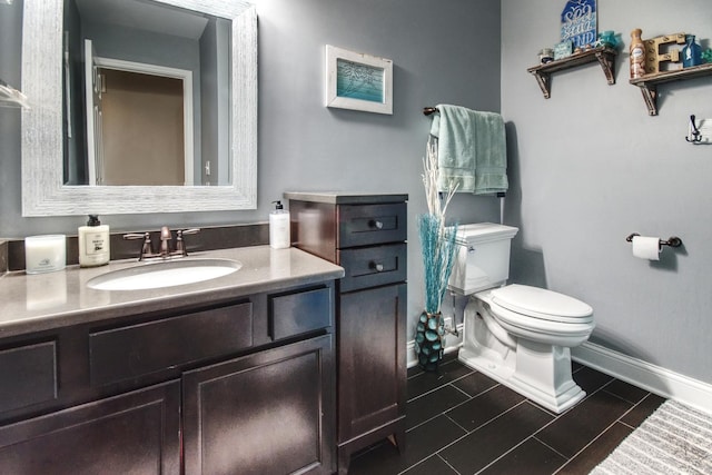 1472 S Saddlebrook Ln, Minooka, IL 60447 - half bathroom featuring toilet, baseboards, vanity, and tile patterned flooring