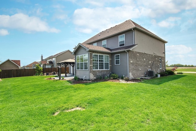 1472 S Saddlebrook Ln, Minooka, IL 60447 - rear view of house featuring a gazebo, a patio area, brick siding, central AC unit, and a shingled roof