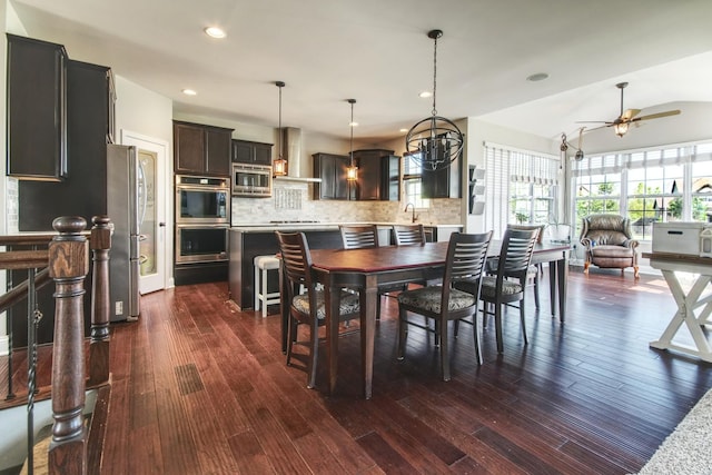 1472 S Saddlebrook Ln, Minooka, IL 60447 - dining area with a ceiling fan, dark wood-style floors, recessed lighting, and a chandelier