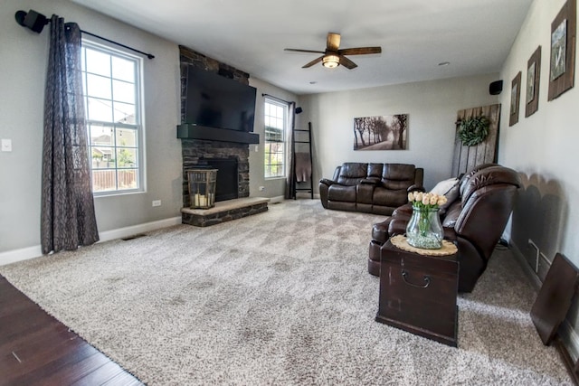 1472 S Saddlebrook Ln, Minooka, IL 60447 - living area with baseboards, ceiling fan, a fireplace, and carpet flooring
