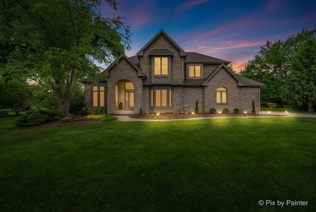 7530 Inverway Dr, Lakewood, IL 60014 - traditional-style house with a yard and brick siding