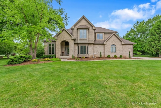 7530 Inverway Dr, Lakewood, IL 60014 - traditional home with a front lawn and brick siding