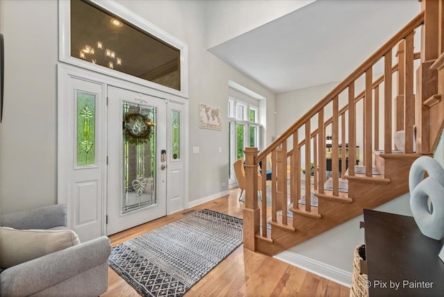 7530 Inverway Dr, Lakewood, IL 60014 - foyer featuring stairway, light wood-style flooring, and baseboards