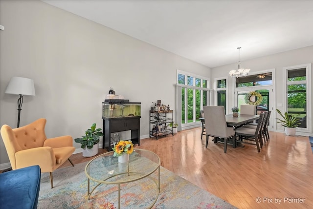 7530 Inverway Dr, Lakewood, IL 60014 - living area featuring a chandelier, healthy amount of natural light, and light wood-style floors