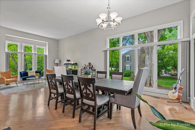 7530 Inverway Dr, Lakewood, IL 60014 - dining space featuring plenty of natural light, a chandelier, and light wood-style flooring