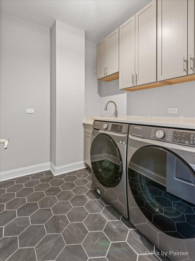 7530 Inverway Dr, Lakewood, IL 60014 - laundry area featuring washing machine and clothes dryer, cabinet space, and baseboards